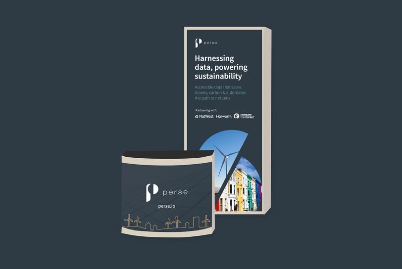 A set of printed conference booth materials featuring a tall back panel and a curved counter.