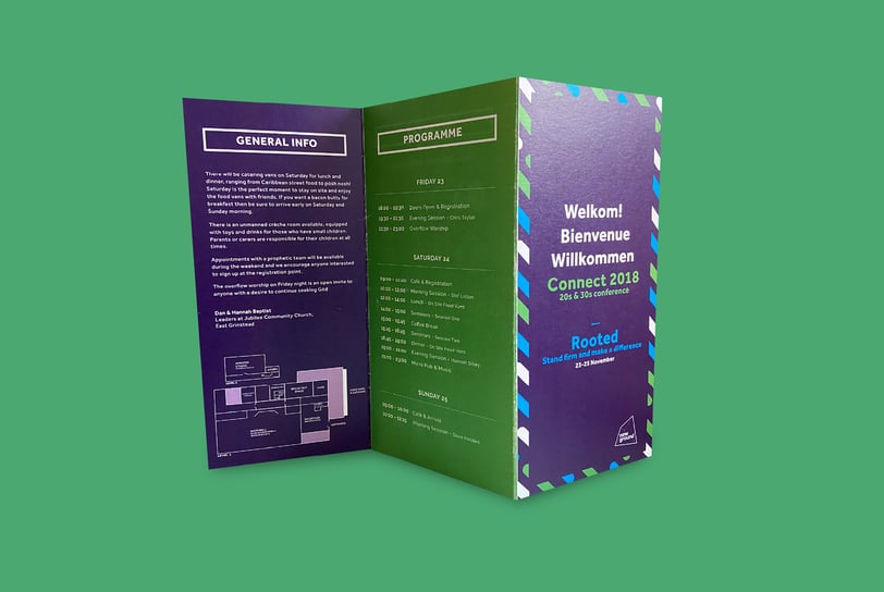Folded conference programme for Connect 2018 featuring a dark green and navy design.