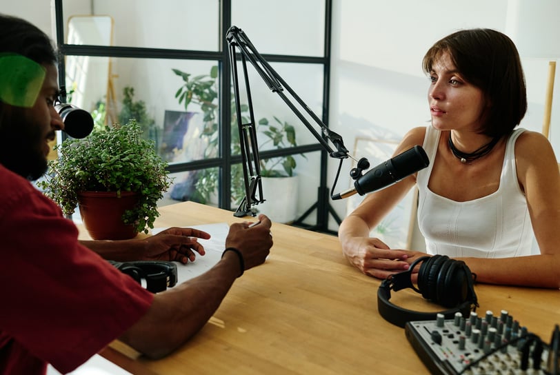 A podcaster interviewing a guest
