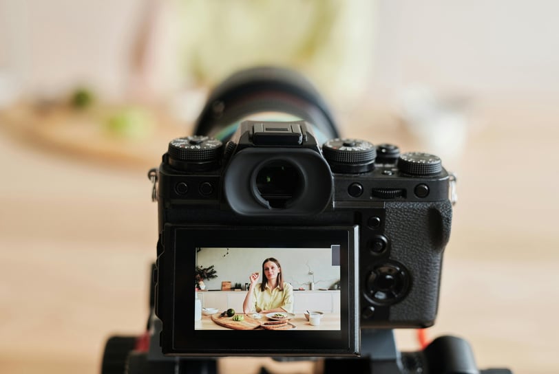 a camera with a woman in a yellow dress