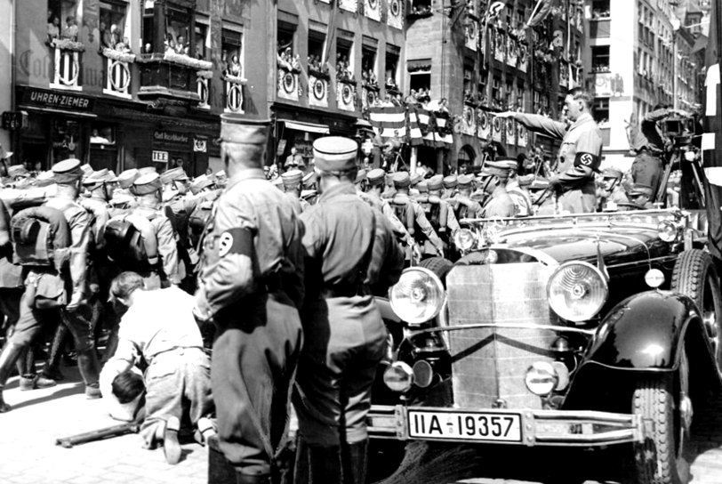 "SA Brownshirts marching past Hitler at the 1935 Nuremberg Rally in Nazi Germany during the height