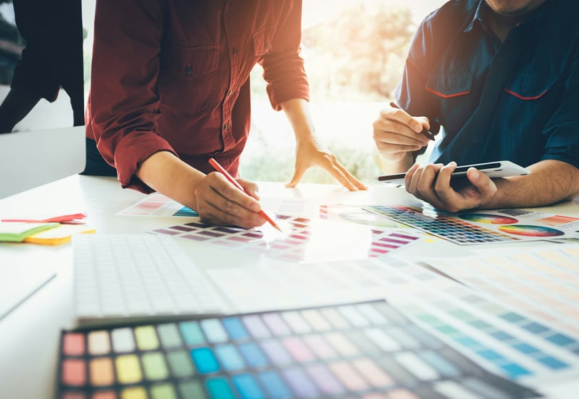 Designers working with color palettes
