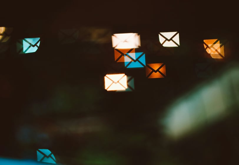 Email marketing concelt - a bunch of colorful envelopes on a black background