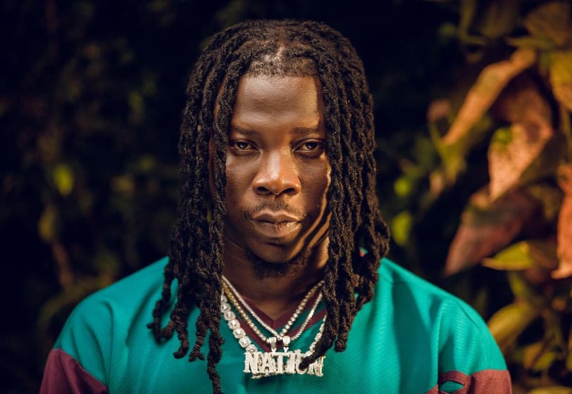Stonebwoy in a green shirt.
