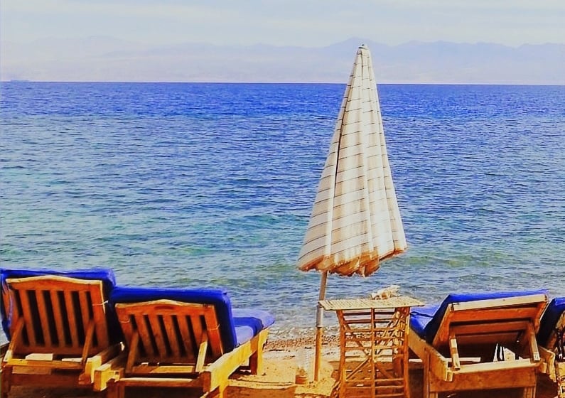 Relaxing in front of the sea on our chaise lounge