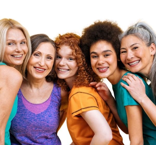 a group of women who are all smiling and posing for a picture