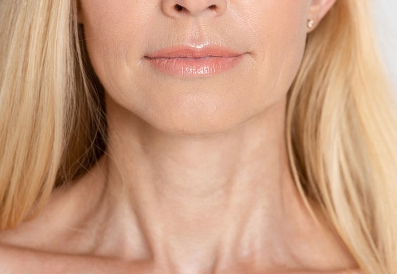 a woman with blonde hair and a white shirt