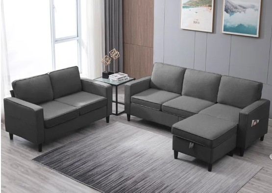 Dark gray sectional sofa in a cozy living room, featured by Regal Touch Home