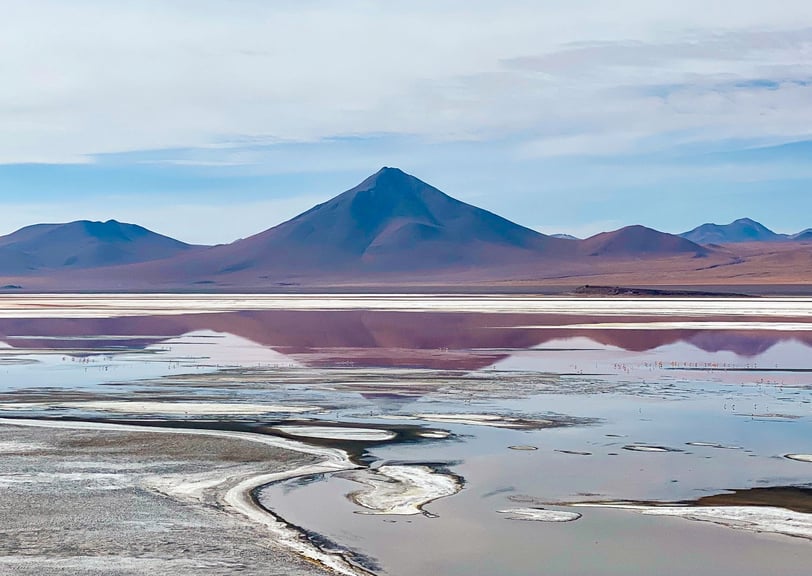 Colorful lagoon in the South Lípez region with vibrant hues of red, and turquoise.