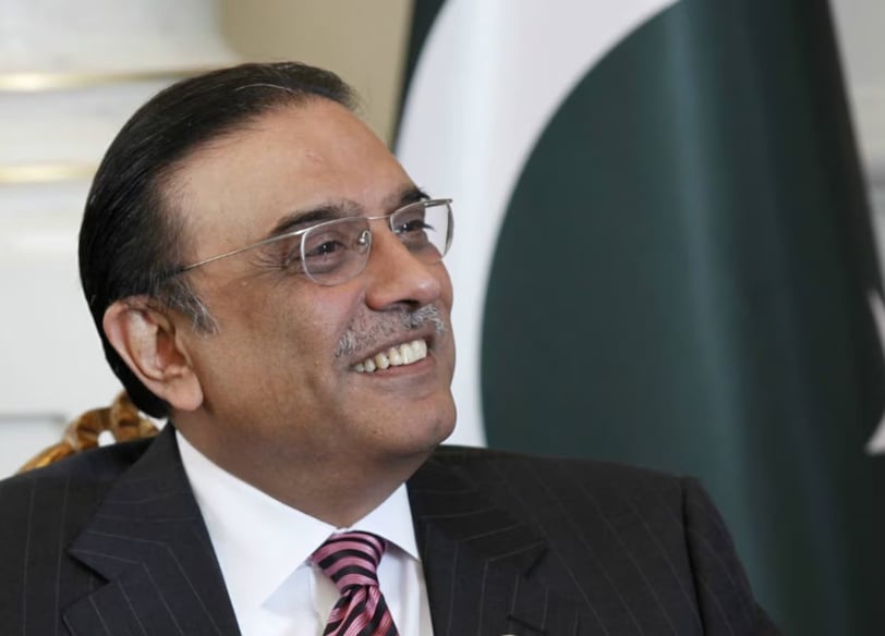 Asif Ali Zardari in a suit and tie smiling