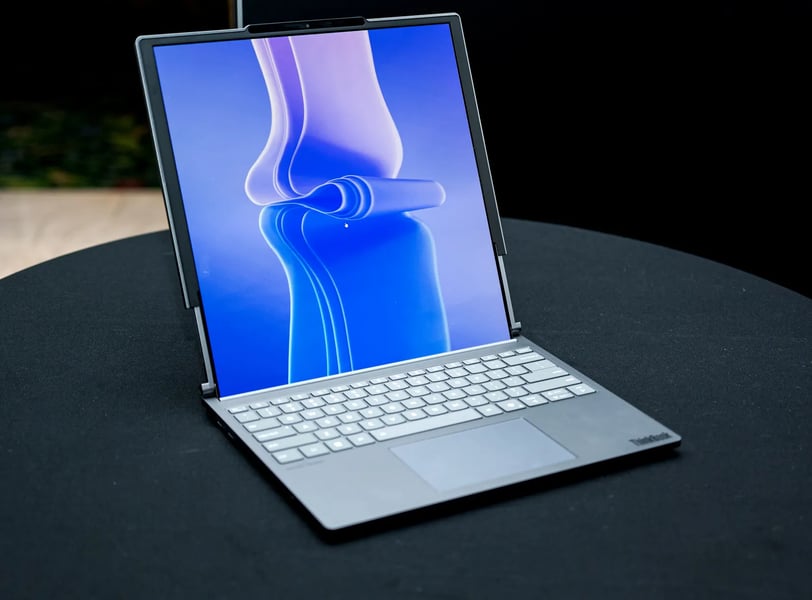 a laptop computer sitting on a table with a laptop on it