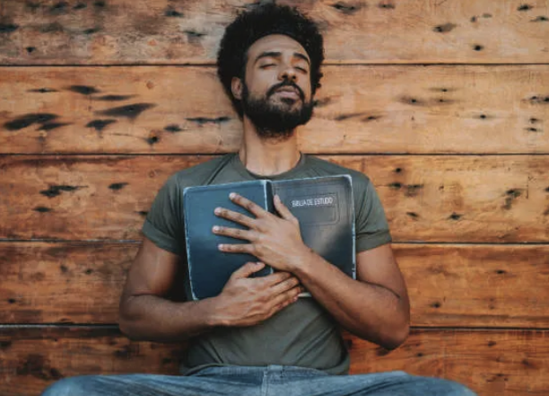a man with a beard and a beard, holding a book