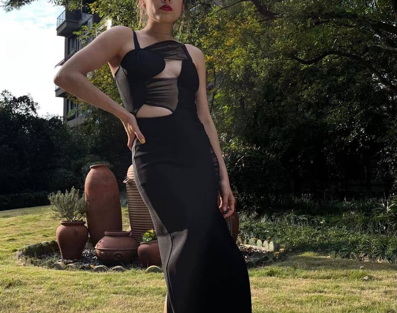 Fashion influencer cynthia Scellos in a black cutout dress from Bella Barnett_ night out dress first