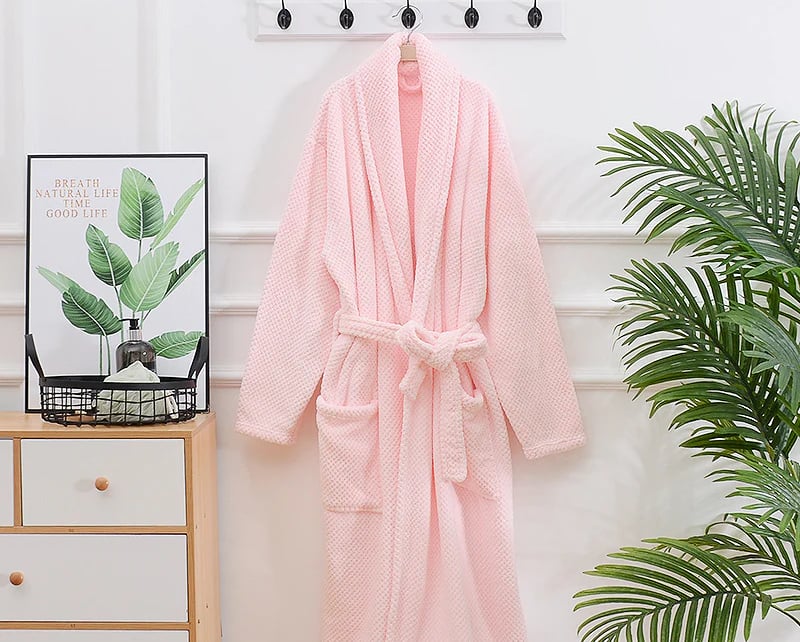 pink terry cloth bath robe hanging