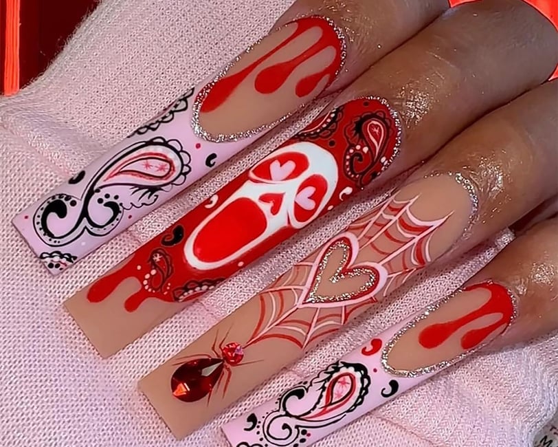 "Display of trendy spooky nail designs for Halloween featuring colorful press-on nails."