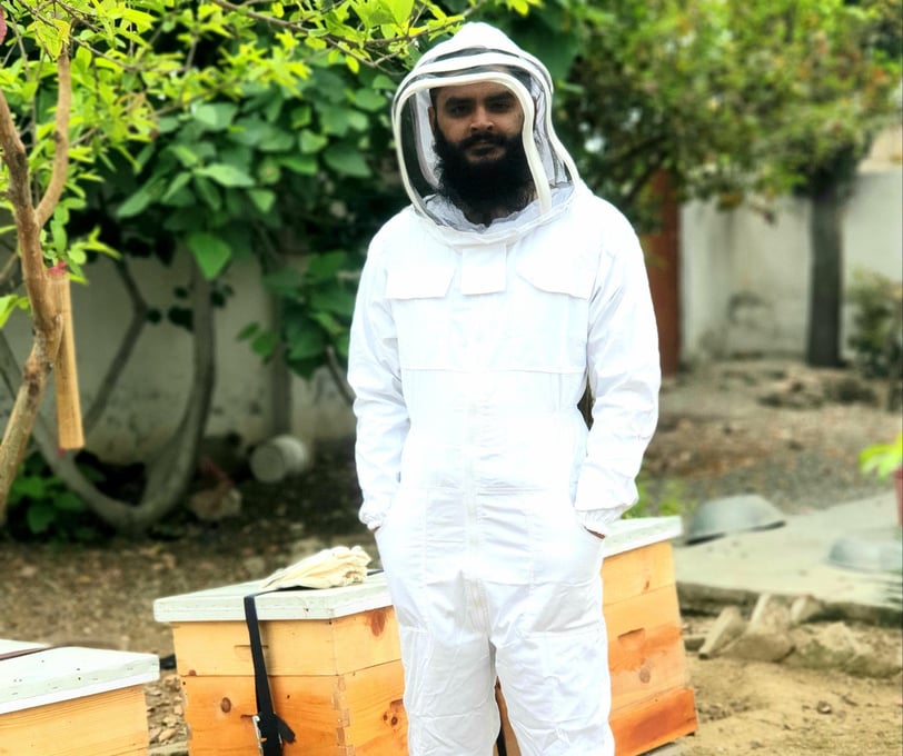 Beekeeper with Hives