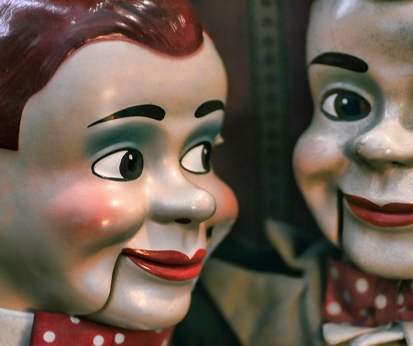 Two dolls looking at each other
