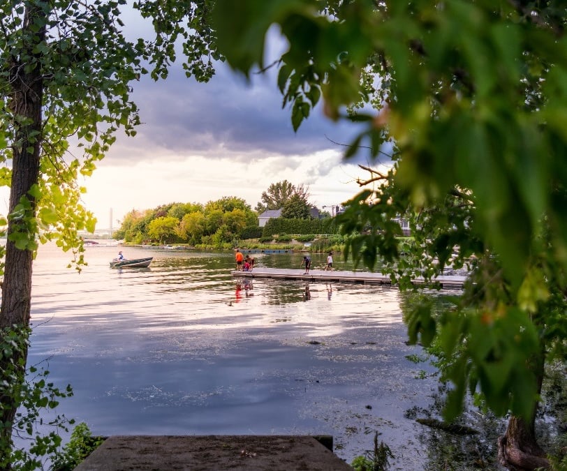 a person in a canoe on a lake Brossard