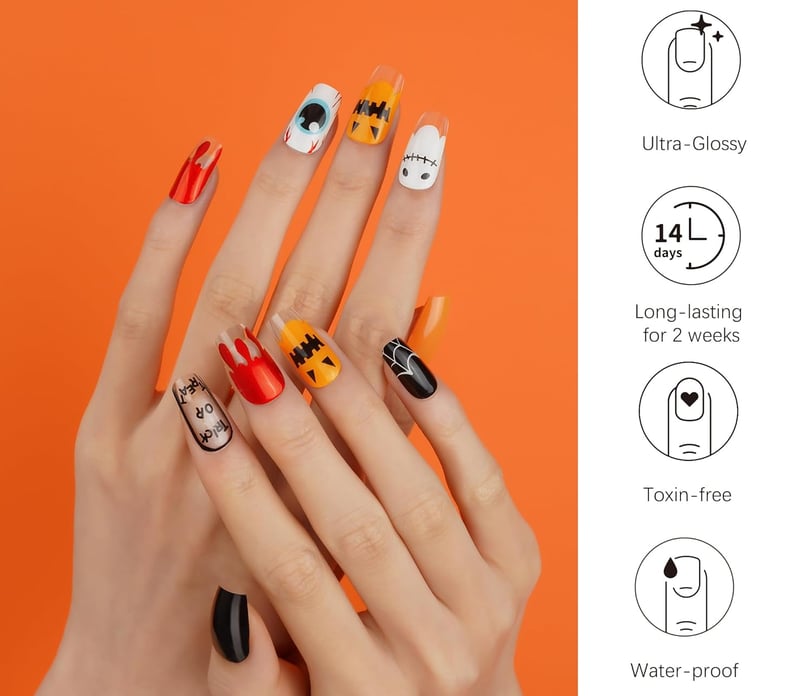 a woman's hands with a halloween nail - art manicures