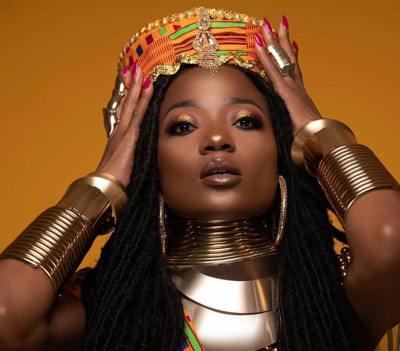 Efya Nocturnal in a kente headgear.