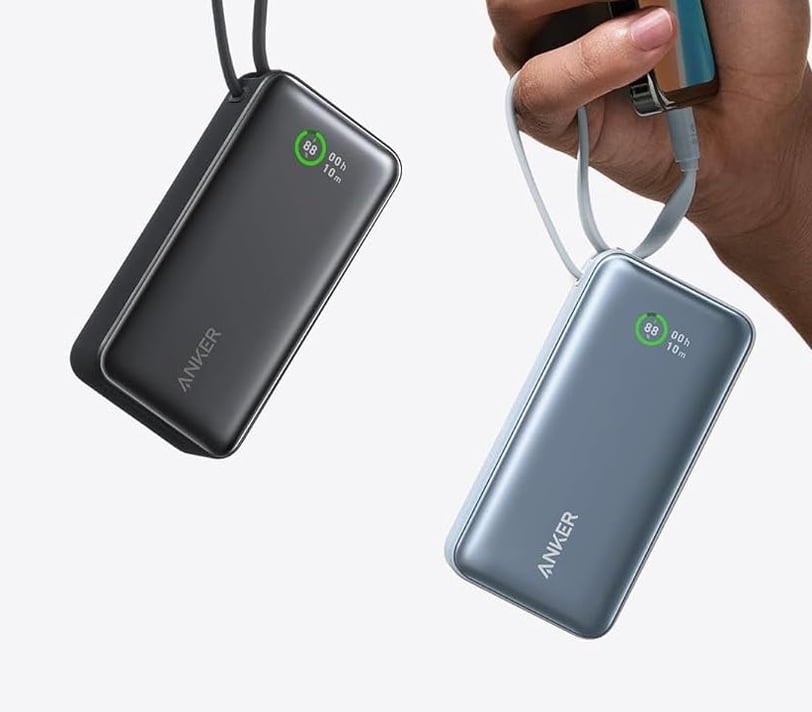 a person holding a cell phone and a cell phone