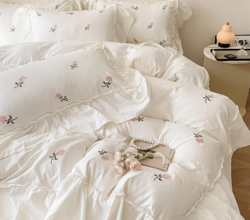 white floral ruffled comforter