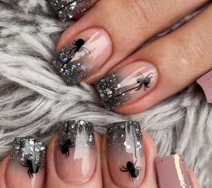 "Colorful press-on Halloween nails featuring spooky designs, perfect for elevating your festive look