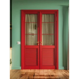 red double open doors with green color painted walls and gold hardware with wood floors 