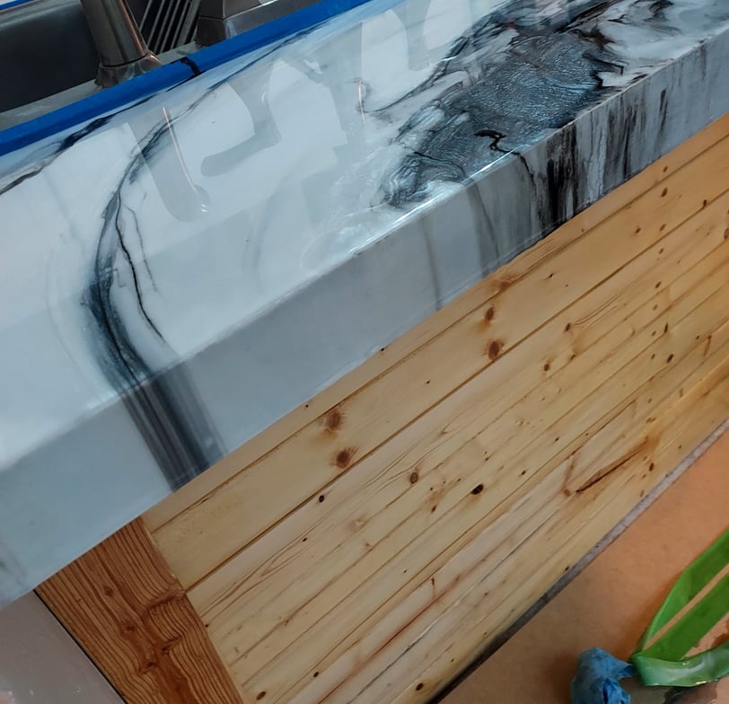 a counter top with a epoxy marble counter top