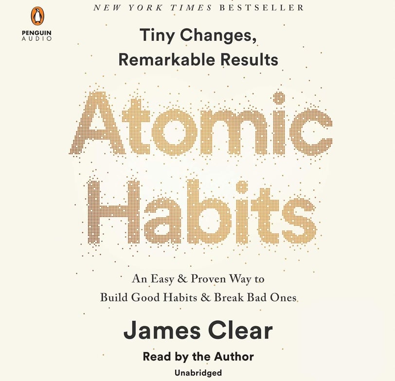 a book cover of a book with the title atomicic habits