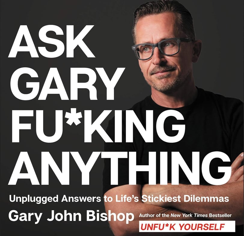 a man with glasses and a black shirt with the words ask, ask, ask