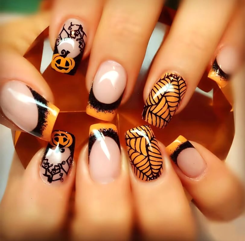 "Stylish Halloween-themed press-on nails featuring spooky designs like ghosts, pumpkins, and cobwebs