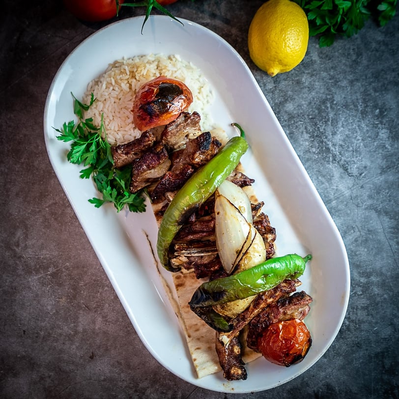 a plate of food with meat and vegetables