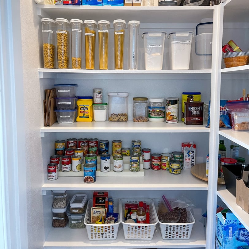 Stockpile pantry with dry food, canned goods, and essentials for food preservation.