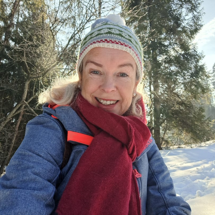 a smiling woman on a snowy day