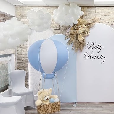 Whimsical hot air balloon decor, creating a magical atmosphere for a 1st birthday celebration.