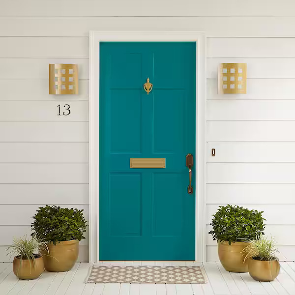 teal front door with gold hardware 