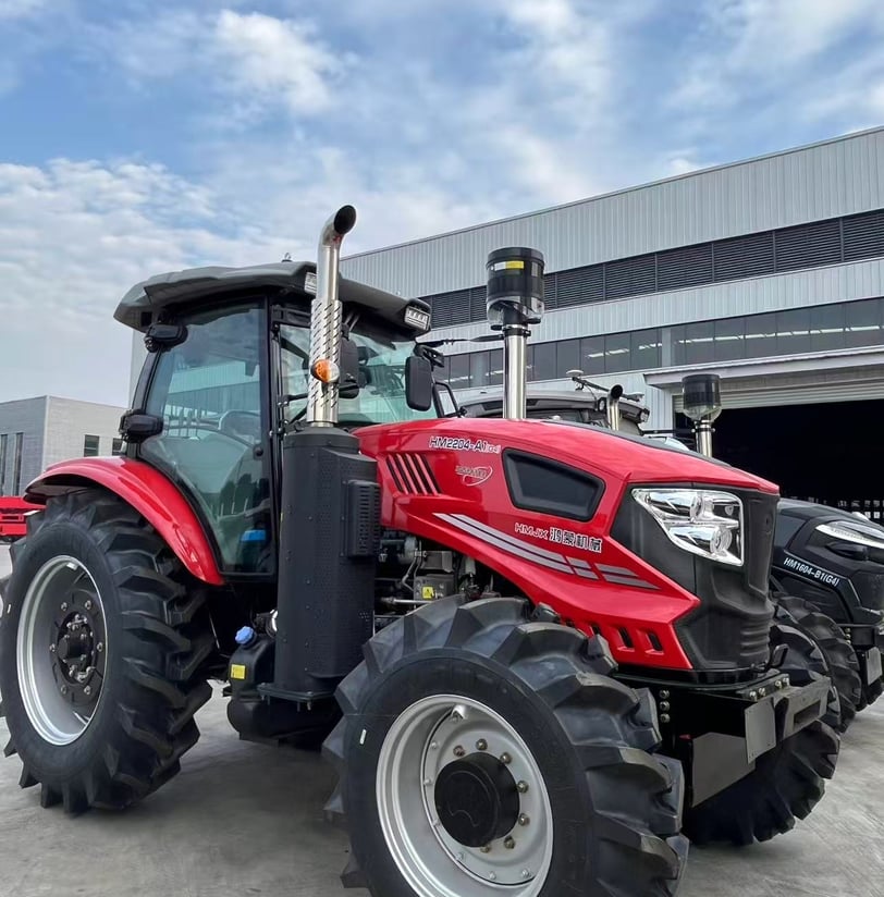 a red tractor with a large wheel on it