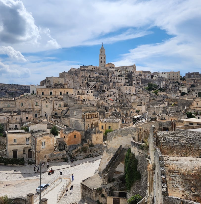 "Ancient stone city of Matera, Italy, featuring historic Sassi cave dwellings and breathtaking lands