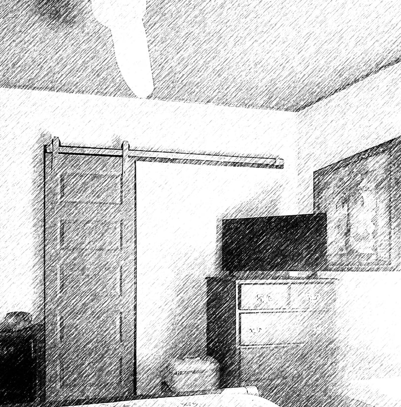 a bedroom with a bed and a television