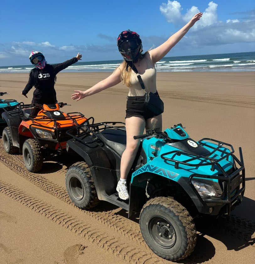 morocco beach a woman riding a four wheeler atv atv atv