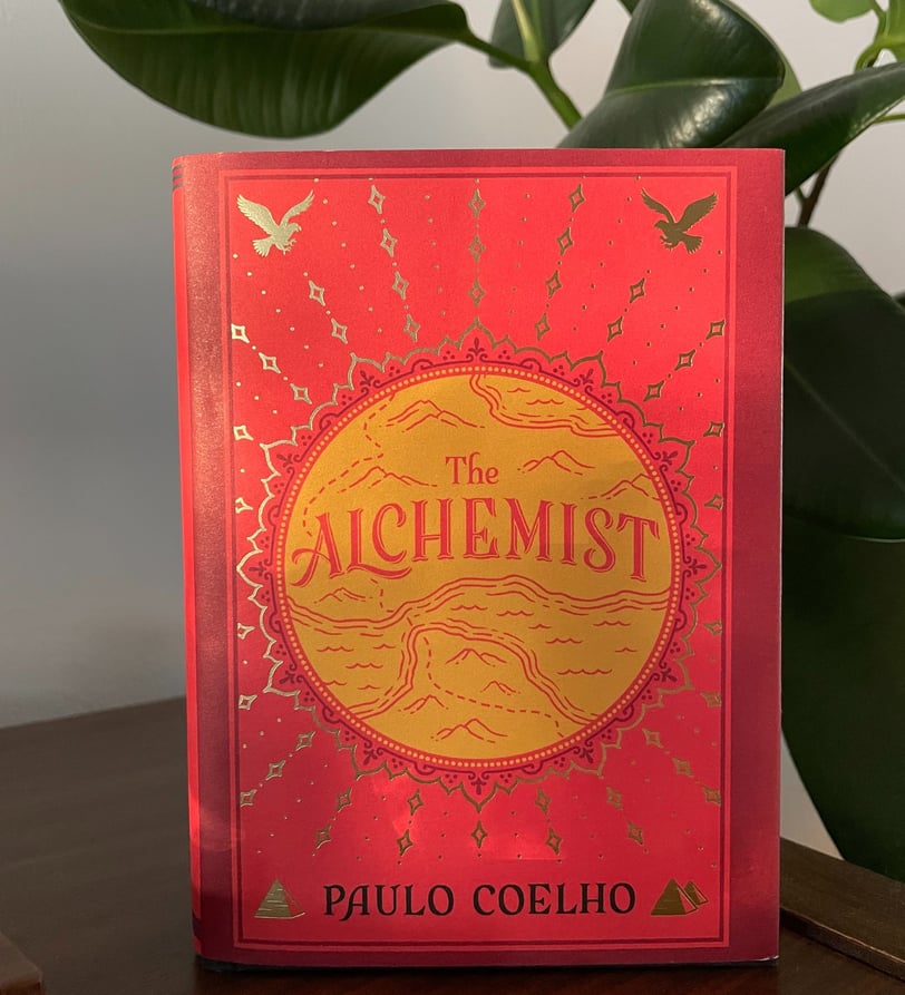 a book cover of the Alchemist
