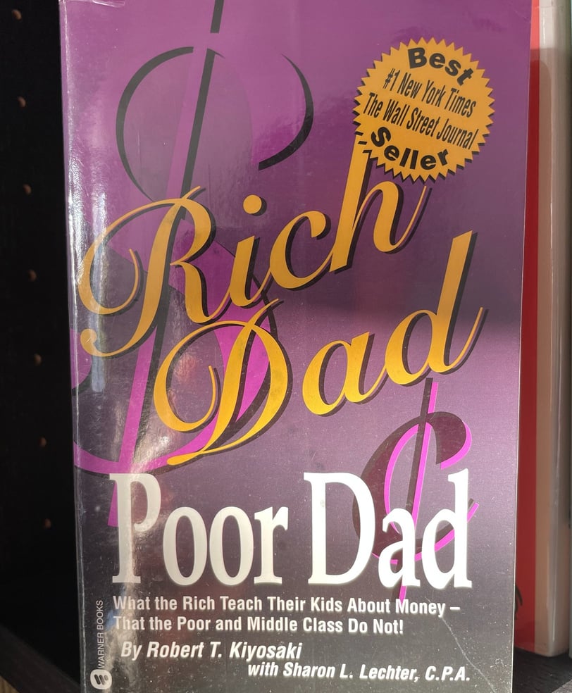 a book cover of rich dad poor dad