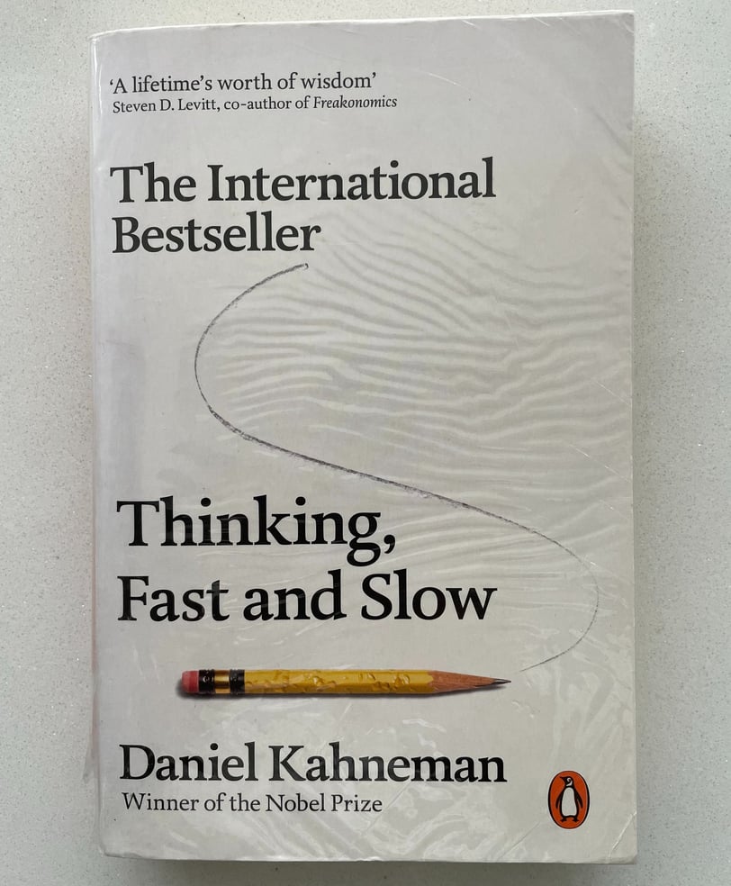 a book cover of Thinking Fast and Slow