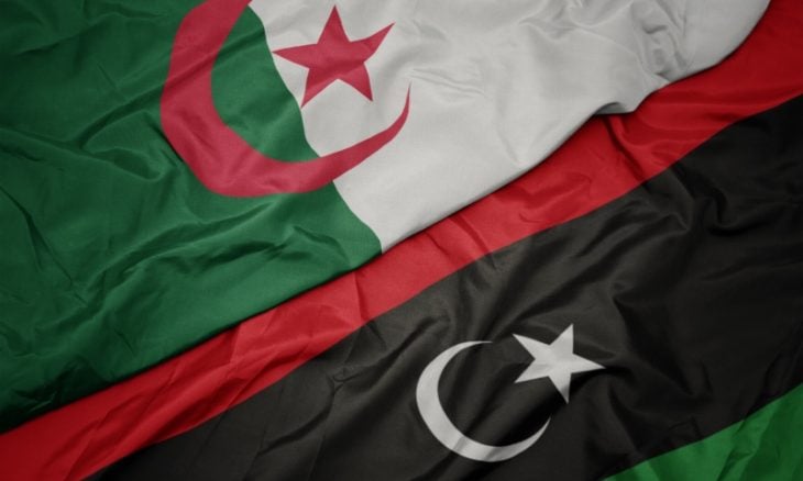a close up of a flag of the country of Algeria and Libya