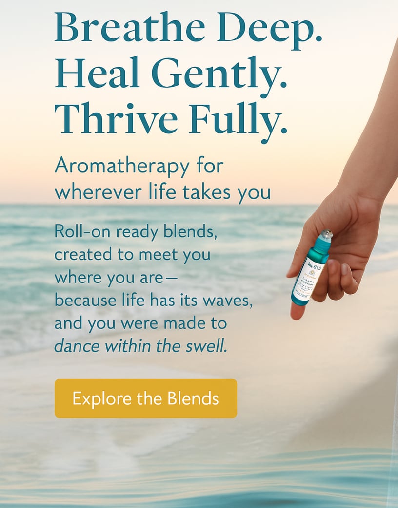 a person holding an essential oil roller bottle by the ocean