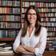 a woman in glasses and a white shirt