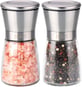 a couple of salt shakers with pink and white salt