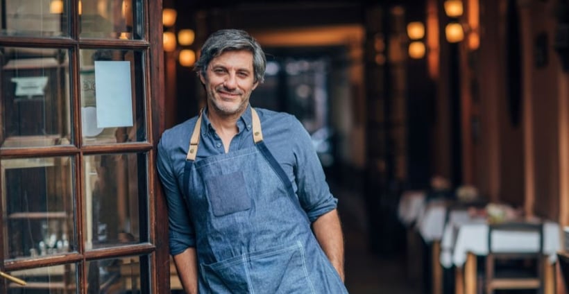 Small business owner in a blue apron and aprons