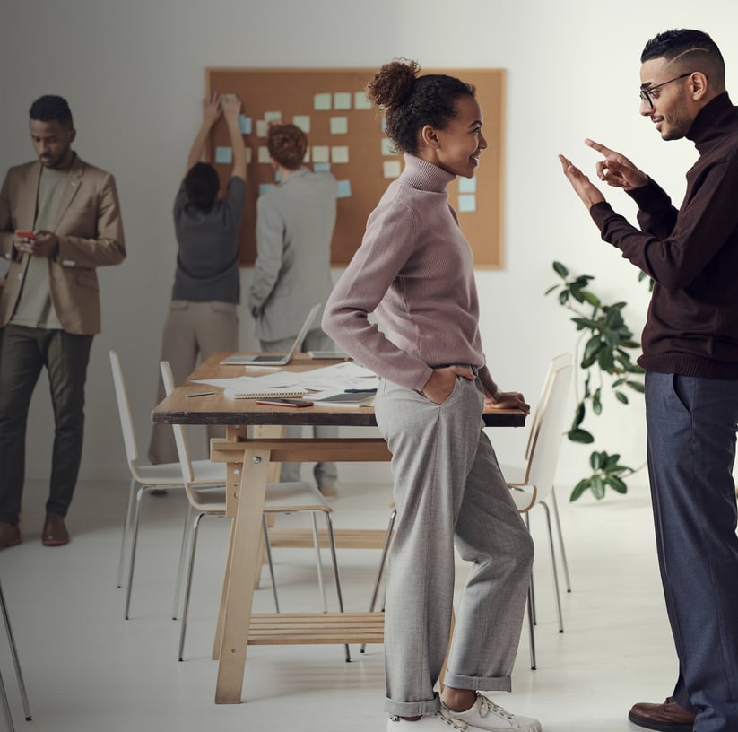 a man and woman standing in a room